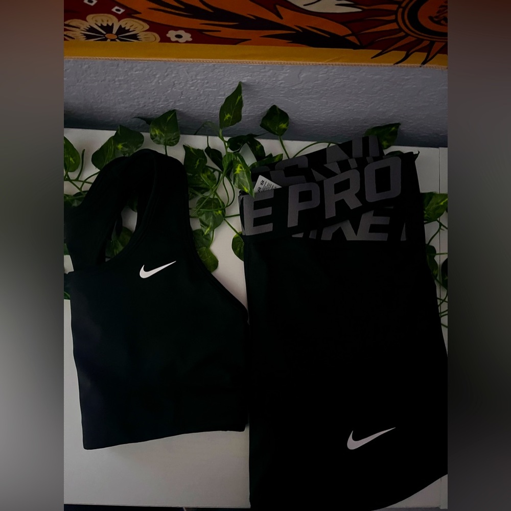 Nike shorts and sports bra bundle. Both size M in woman, in color black.